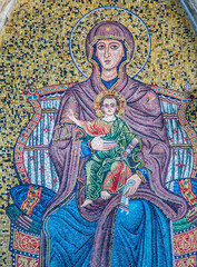 Captivating mosaic of Madonna with child under Torre dell'Orologio in Taormina, Italy, showcasing intricate artistry and religious significance