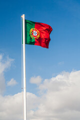 Portuguese Flag Waving in Lisbon's Clear Blue Sky