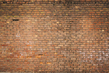 Non-linear pattern of an old shabby brick wall with natural patterns of paint chips. Restoration of semi-antique brick walls. A basic neutral background for a design project.