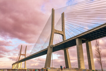 Fototapeta premium Lisbon, Portugal, March 1 2007, Vasco Da Gama Bridge Arches Over Lisbon's Tagus River