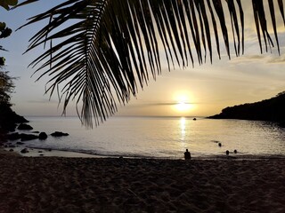 sunset over the horizon, seen from the beach in Basse Terre, Guadeloupe. Evening on the caribbean...