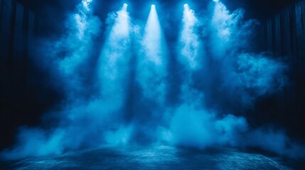 Blue stage lights shine down through ethereal clouds of smoke a dark black backdrop casting dynamic shadows and setting the perfect scene for an intense and atmospheric show