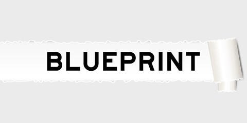 Ripped gray paper background that have word blueprint under torn part