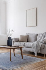 cozy living room featuring light gray sofa adorned with soft throw blanket, complemented by wooden coffee table and decorative vase. serene atmosphere invites relaxation and comfort