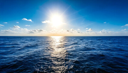 Fototapeta premium Panorama of the blue ocean with reflections of the sun. vast open sea ripples and the calm sea with beautiful sunshine and sunsets.