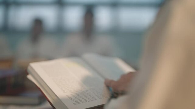 Jewish books reading turning pages of Torah