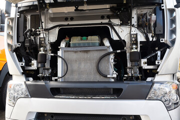 Truck with an open motor compartment