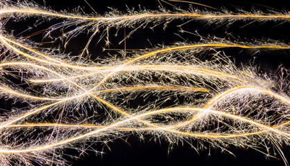 Christmas sparklers abstract light trails on black background