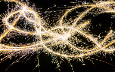 Christmas sparklers abstract light trails on black background