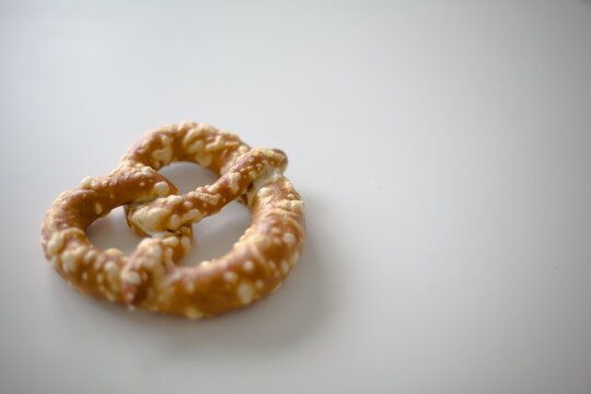 Golden Brown Pretzel on a White Table