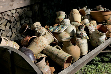 Large pile of old jugs on a cart