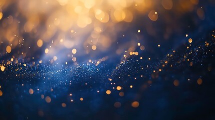 Obraz premium Abstract blue and gold bokeh background with sparkling lights.