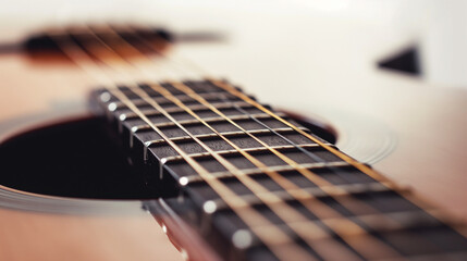 Fototapeta premium Acoustic guitar on a white background, showcasing its wooden body and craftsmanship.