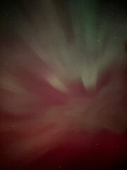 background auroral borealis in the night sky looking up 