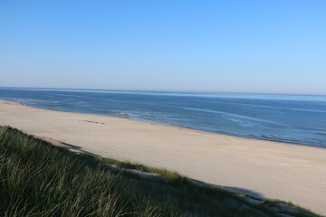 beautiful view from a high dune onto a deserted North Sea beach