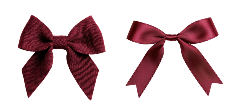 Two elegant maroon satin bows on a white isolated background.