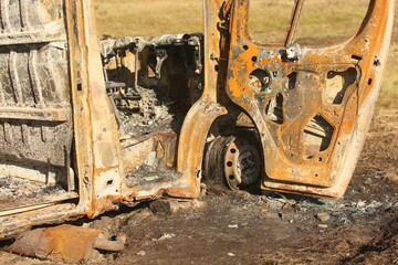Fototapeta premium Big old burnt bus near the road