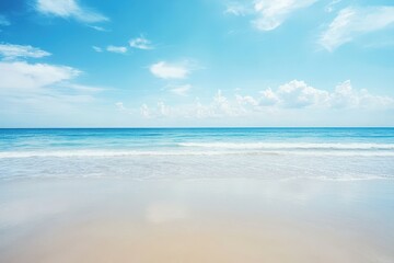 Fototapeta premium Serene tropical beach scene with clear blue sky and ocean