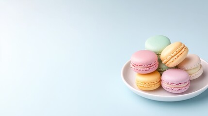 Fototapeta premium Colorful macarons arranged on a white plate
