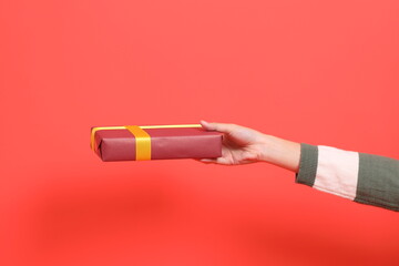 Hand holding gift box