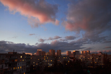 Fototapeta premium Apartment Buildings with Stormy Sky at Sunset