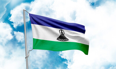 Lesotho flag waving on sky background. 3D Rendering