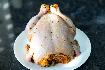 Rustic roast chicken stuffed with farofa