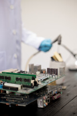 Technicians meticulously repair electronic components to turn them into precious gold. This process...