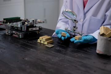 Technicians meticulously repair electronic components to turn them into precious gold. This process...