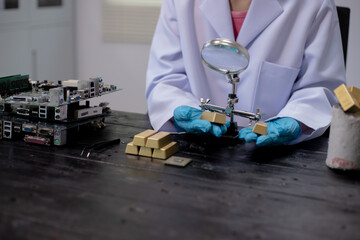 Technicians meticulously repair electronic components to turn them into precious gold. This process...