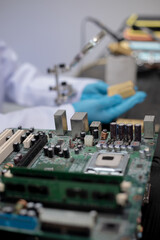 Technicians meticulously repair electronic components to turn them into precious gold. This process...