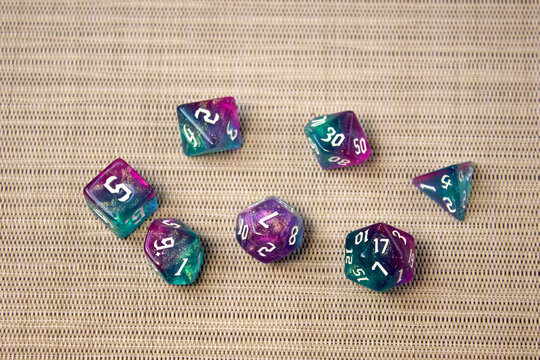 Set of dice for fantasy dnd and rpg tabletop games Board game polyhedral dices with different sides on wooden background
