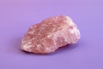 Piece of polished pink quartz as nice background. Minimal color still life Narrow focus line,...