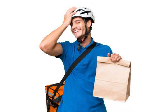 Young caucasian man taking a bag of takeaway food over isolated background smiling a lot