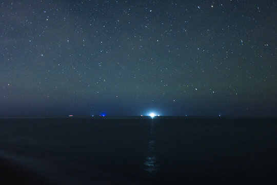 Night stars, Stars background a blue starry sky at dark night, Space Night Dark Sky Nebula Cosmos Texture Universe Cosmic Backdrop Astronomy, Panorama of milky way, sandy beach, Ship Light in sea.
