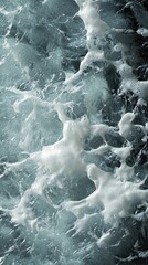 Fototapeta premium A stunning close-up of ocean waves, capturing the dynamic interplay of water and foam in vibrant shades of blue and white.