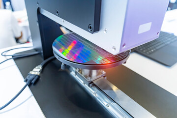silicone wafer under the microscope process examining testing in microscope.