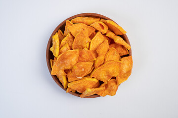 A bowl of fried food with a lot of pieces in it