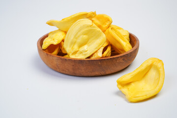 A bowl of yellow pieces of fruit