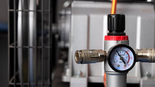 Pressure Gauge on Compressor Showing Kilopascal Reading - Close-Up of Industrial Pressure Sensor Display