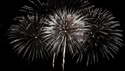Obraz premium Beautiful illustration of colorful fireworks on plain black background. Colorful Fireworks in black sky background for New Year celebration concept. High quality illustration