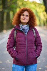 Woman with backpack in park