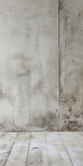 Fototapeta premium A rustic concrete wall with visible textures and a wooden floor, perfect for backgrounds or creative projects.