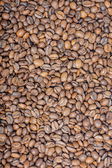 Coffee beans vertical photo. Roasted Arabica coffee.