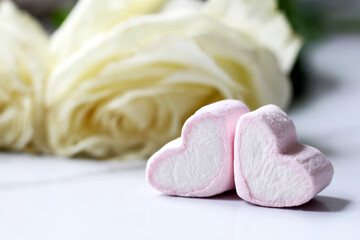 Pink marshmallow hearts and white rose, romantic dessert