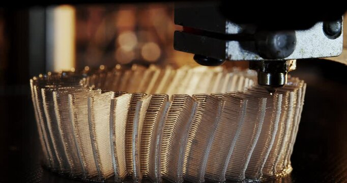 3D printer working. Fused deposition modeling, FDM. 3D printer printing an object from plastic. Automatic three dimensional 3d printer performs plastic. Progressive additive technology for 3d printing