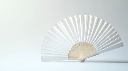 Close-up view of a white folding hand fan, fully opened against a bright white background for product mockup.