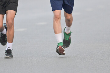 Fototapeta premium Fitness and sport man running in outdoor by training, exercise and practice for marathon competition of cardio health.Athlete as runner together for performance progress goal