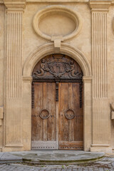 Ornamented wooden door in Aix-en-Provence in Provence-Alpes-Cote d'Azur region in the South of...