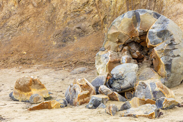 Moeraki Boulders in New Zealand. Famous landmark large spherical stones on Koekohe Beach near Moeraki on New Zealand's Otago coast. A popular tourist attraction